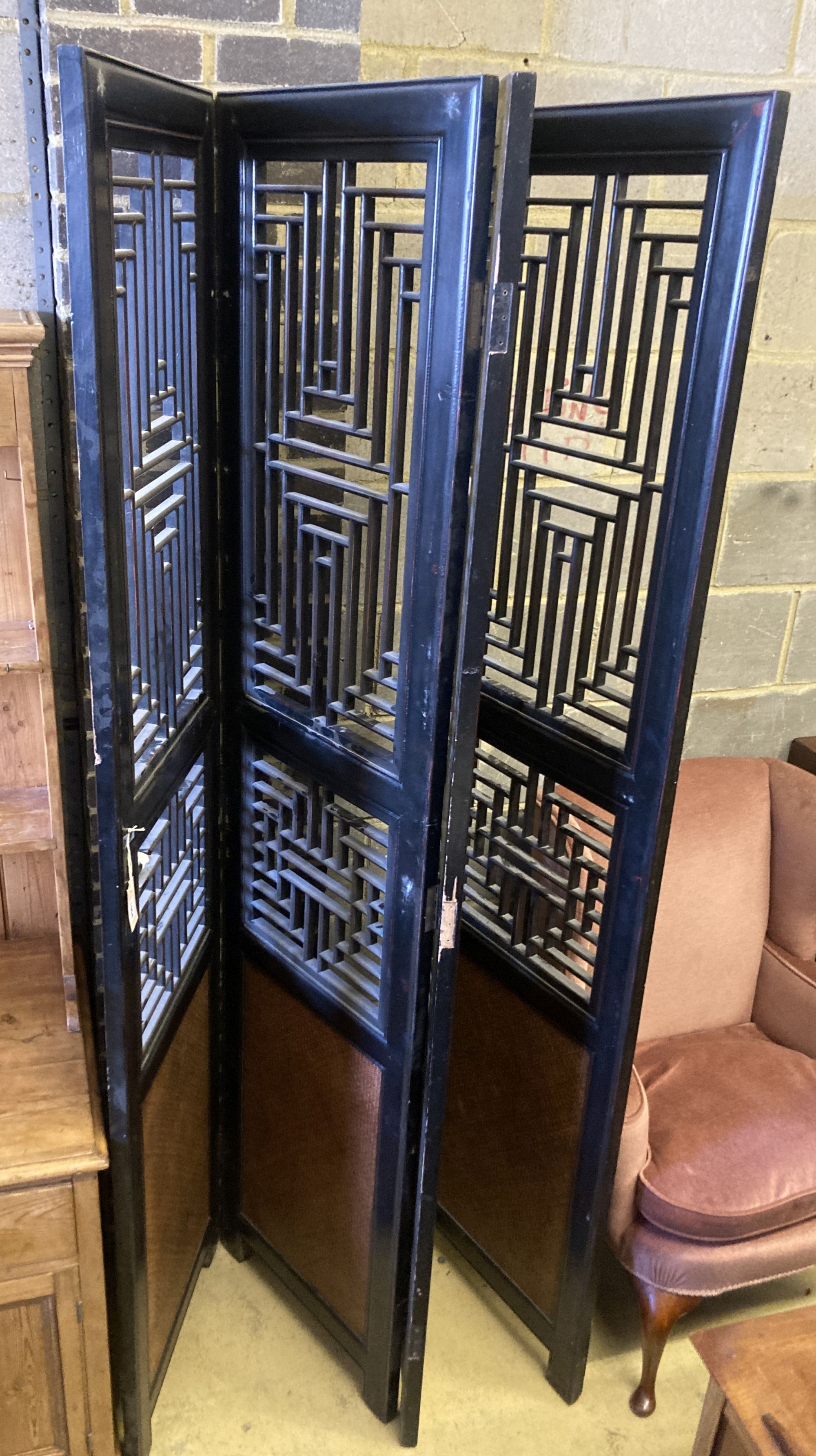 A Chinese hardwood and rattan four-fold decorative screen, each panel width 52cm, height 220cm